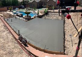 new concrete slab in residential backyard